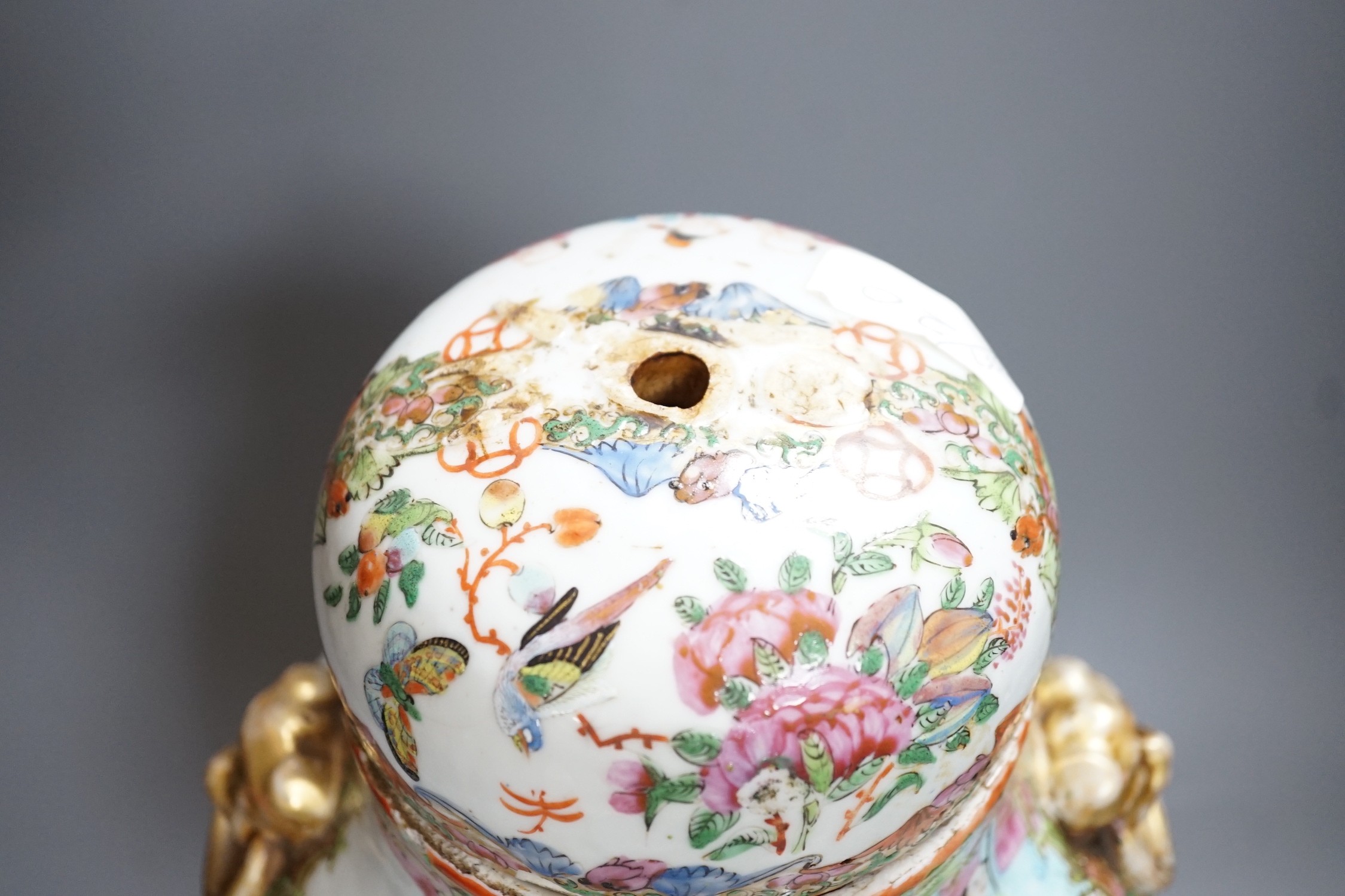 A 19th century Cantonese famille rose baluster vase and cover, the latter lacking a knop finial, 38cms high